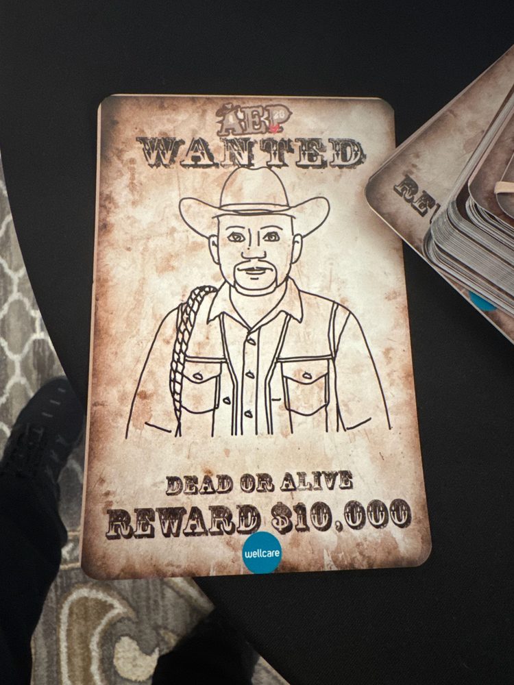 Finished robot-drawn caricature of a guest in a cowboy hat with a rope, printed on a Wild West WANTED poster background with Dead or Alive reward text